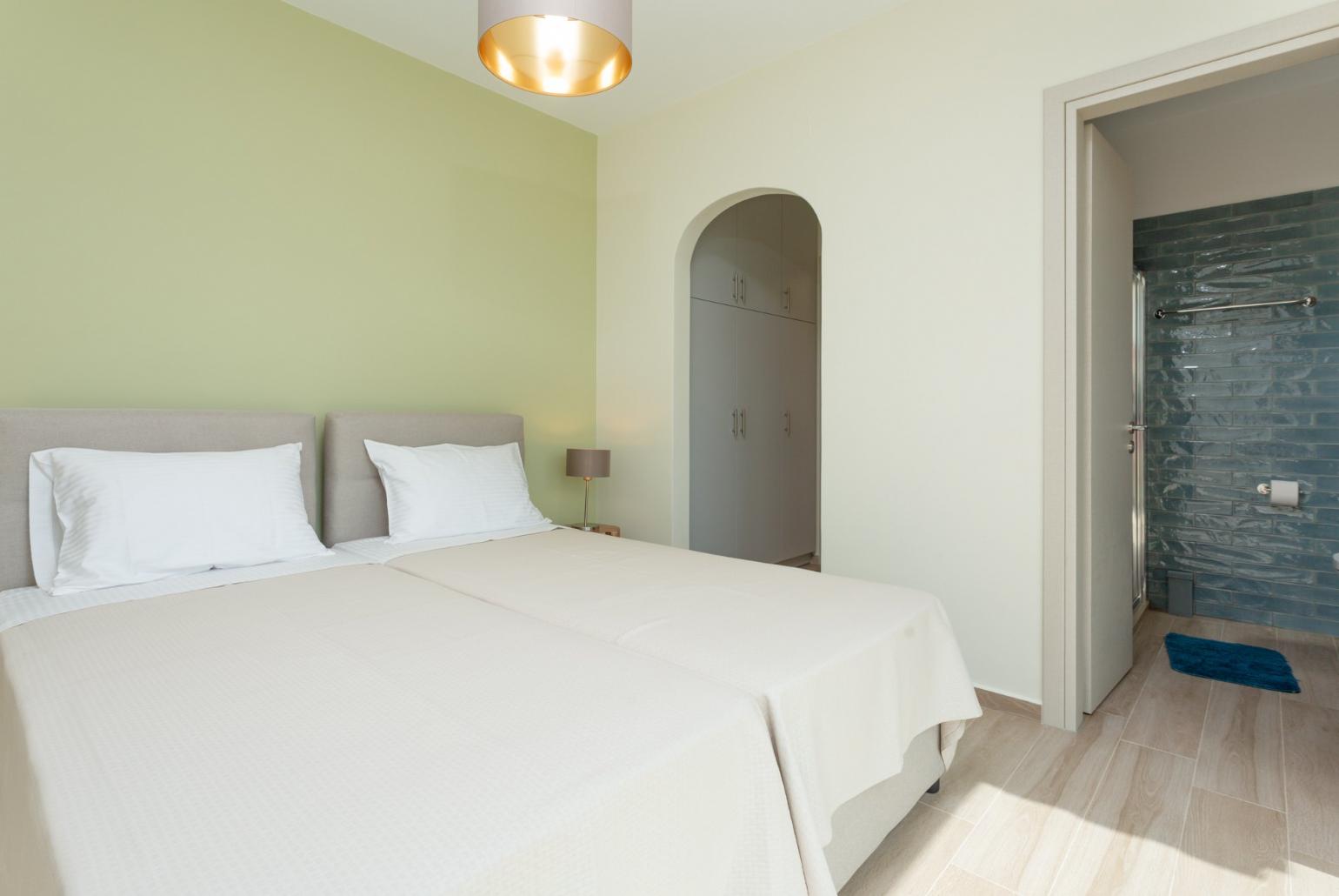 Twin bedroom with en suite bathroom, A/C, and balcony access with sea views