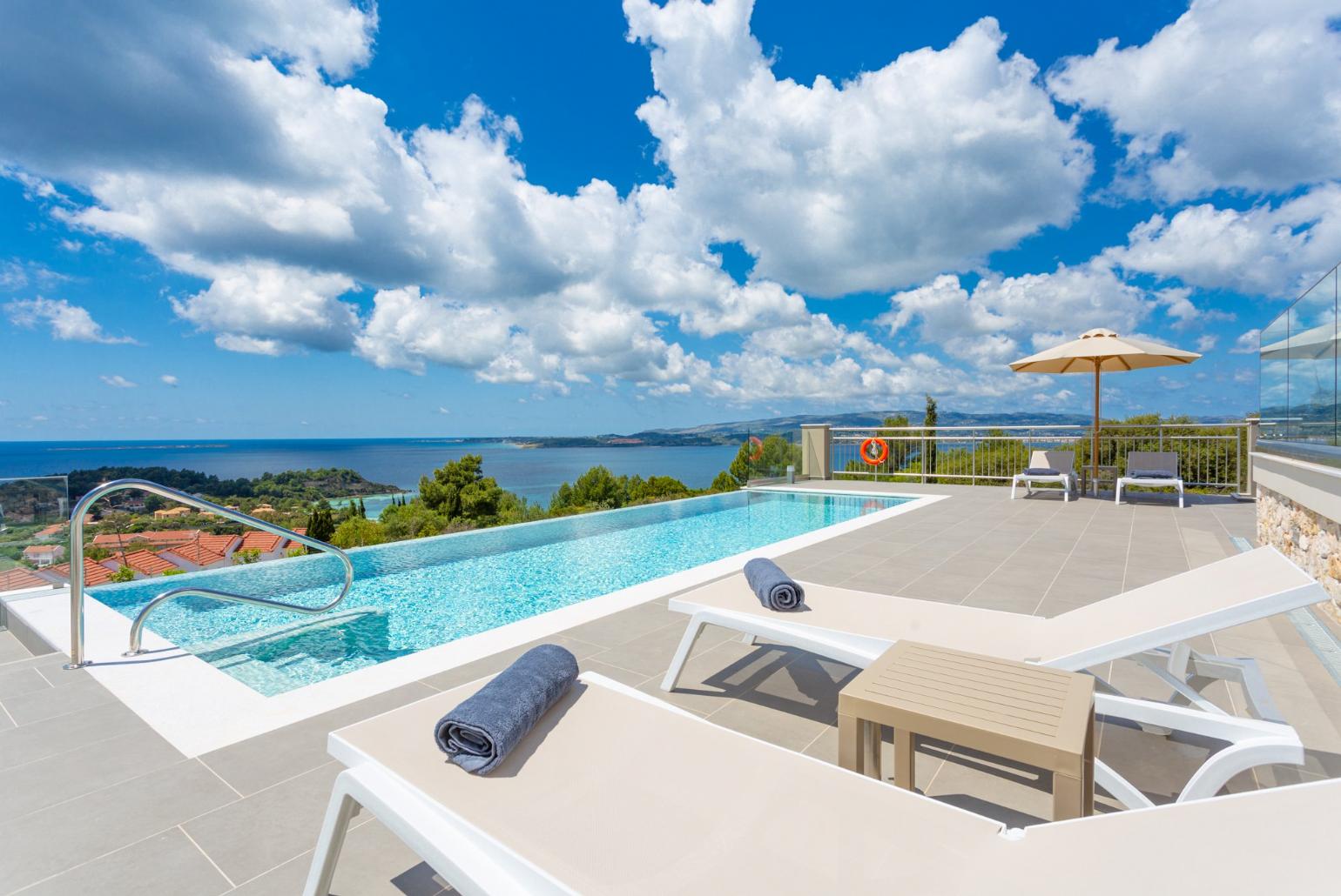 Private infinity pool and terrace with panoramic sea views