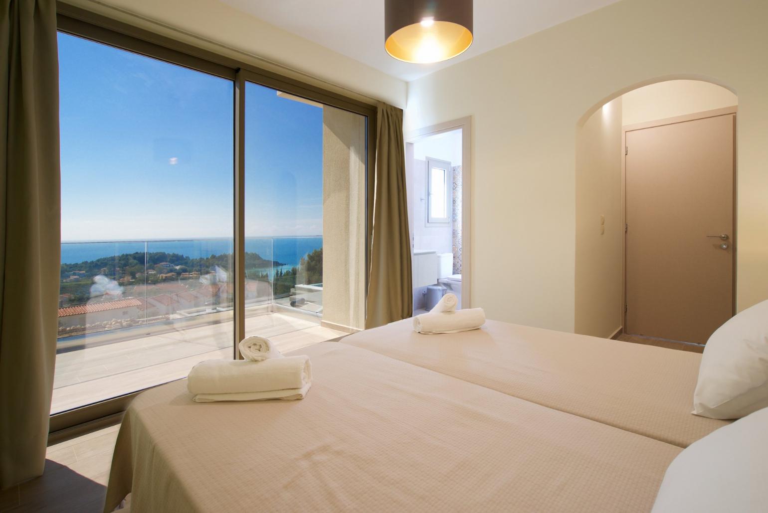 Twin  bedroom with en suit bathroom and beautiful view