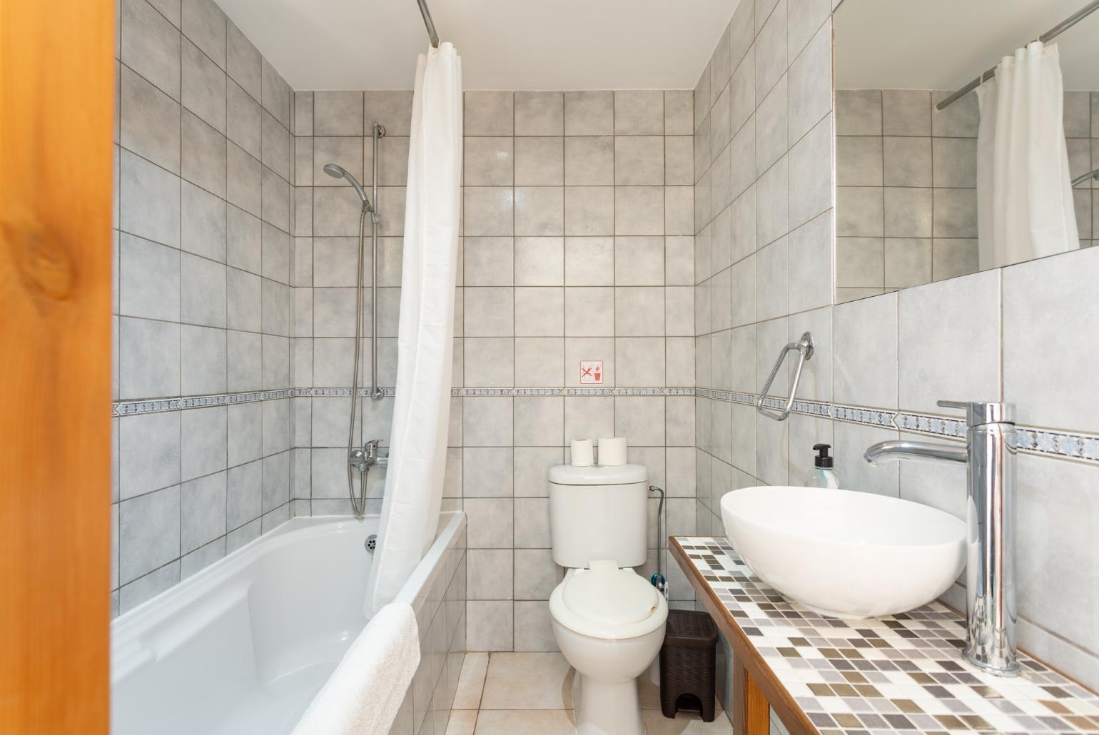 Family bathroom with bath and shower