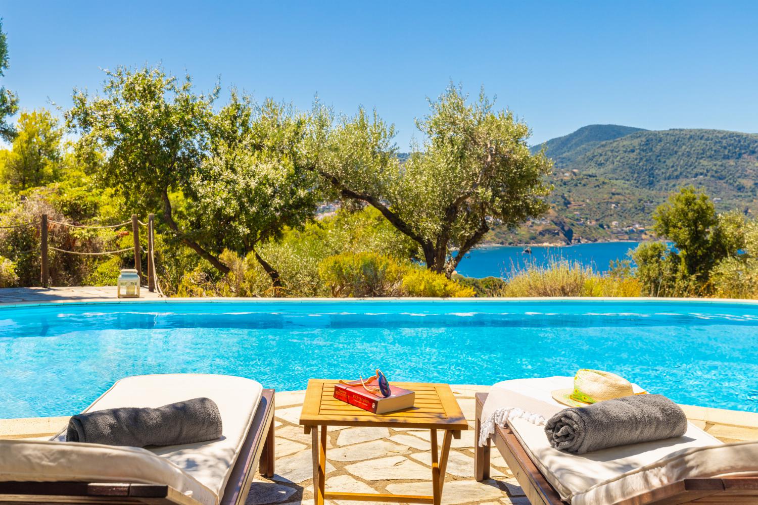 Private pool, terrace, and garden with sea views