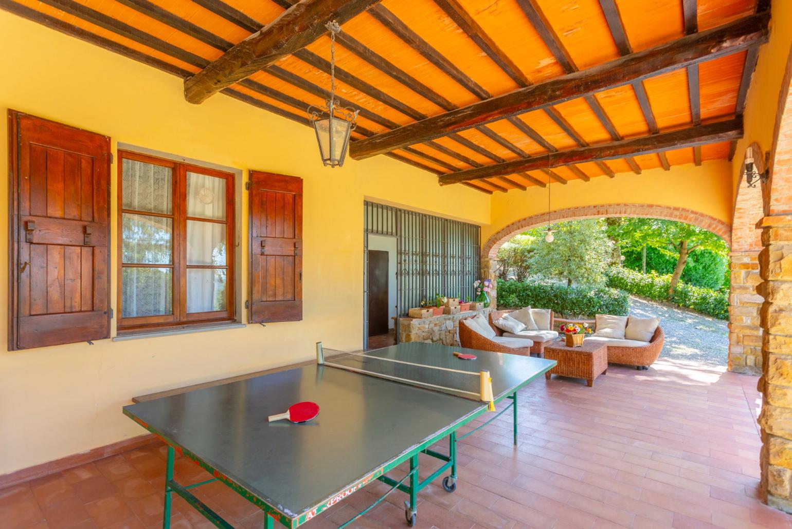 Sheltered terrace area with table tennis