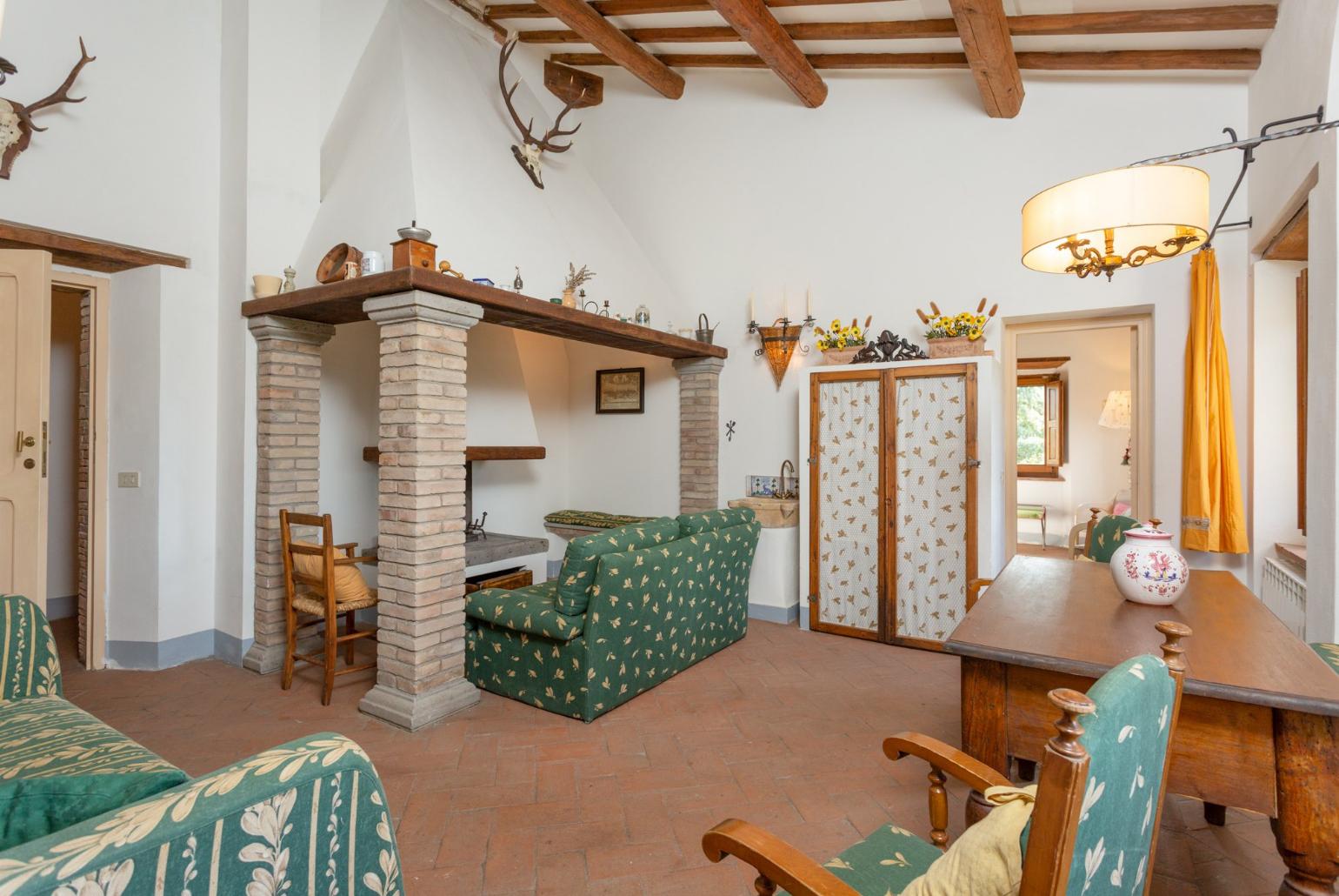 Living room on first floor with sofas and ornamental fireplace