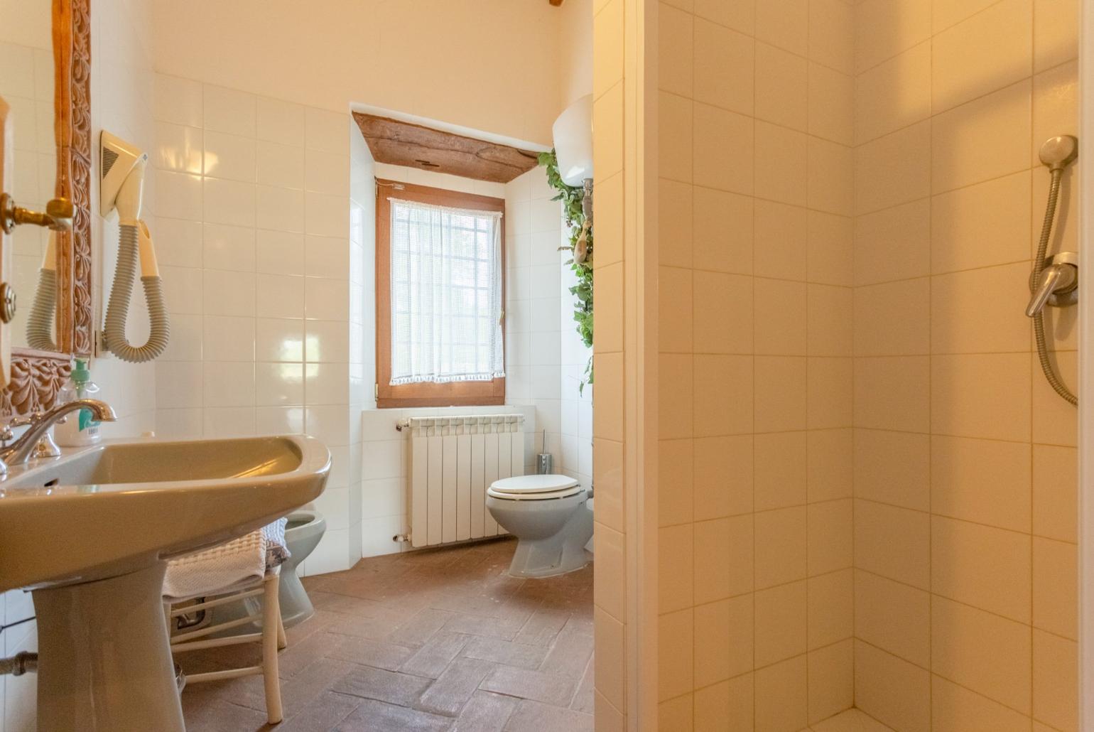 Family bathroom with bath and shower 