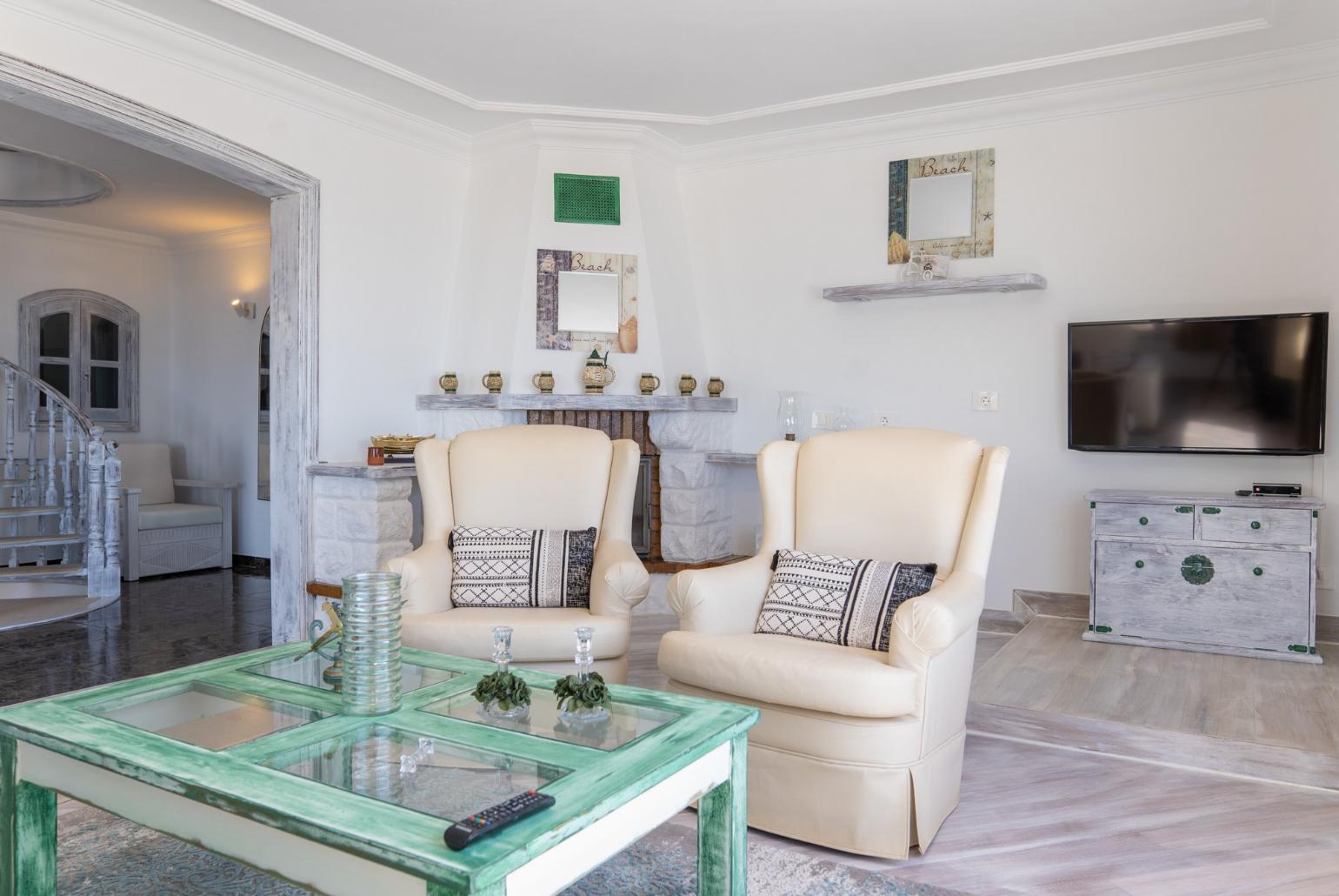 Living room with Ornamental fireplace, TV and beautiful view