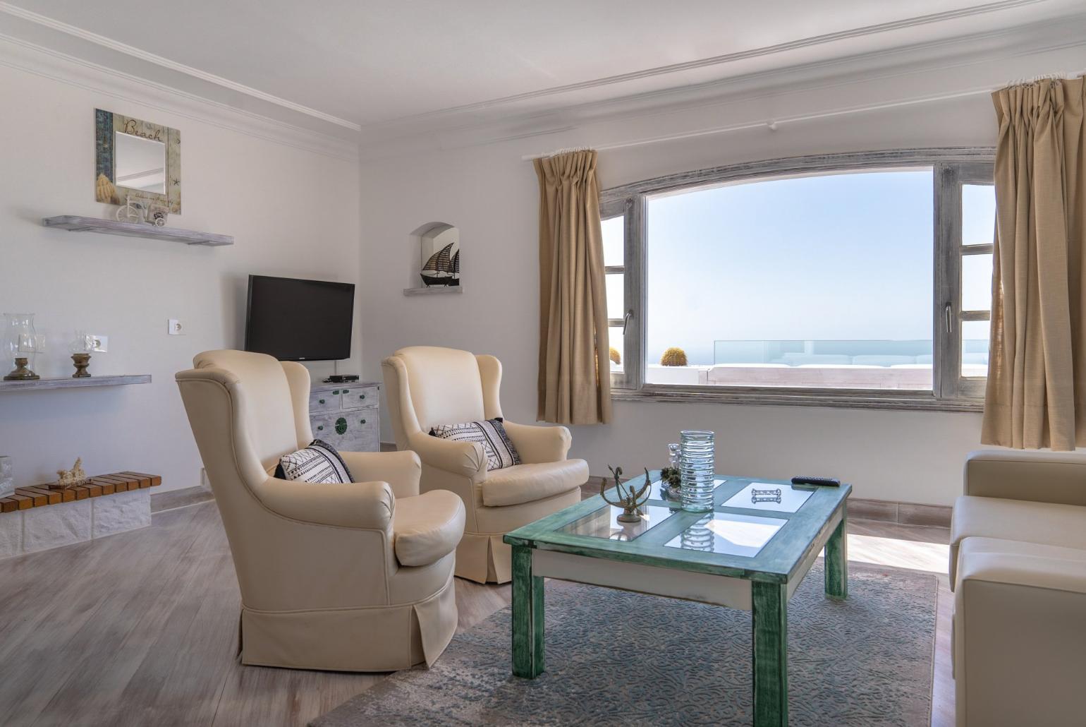 Living room with Ornamental fireplace, TV and beautiful view