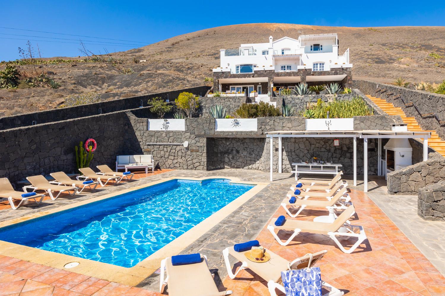 ,Beautiful villa with private pool, terraces, and garden with panoramic sea views