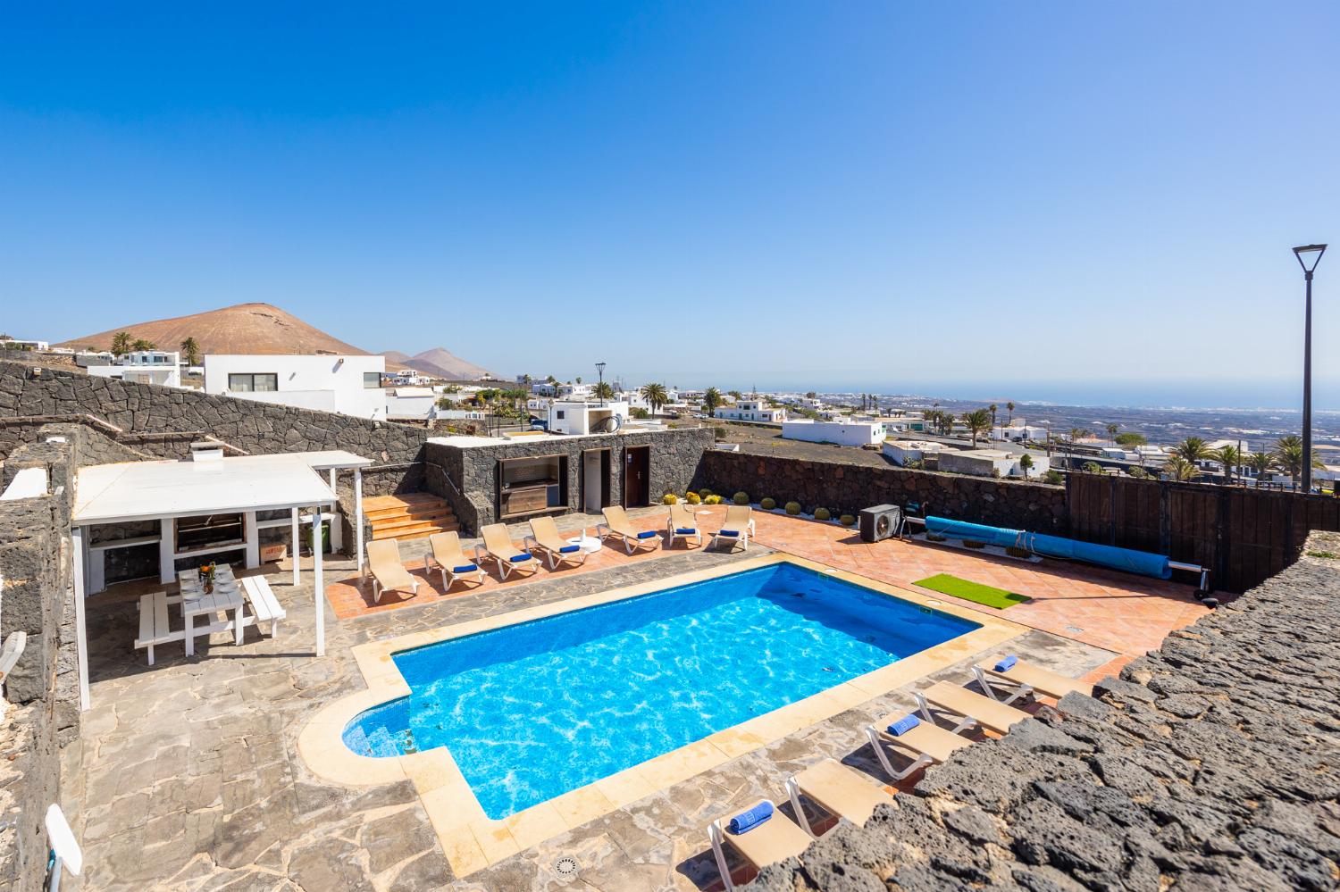 Private pool, terraces, and garden with panoramic sea views