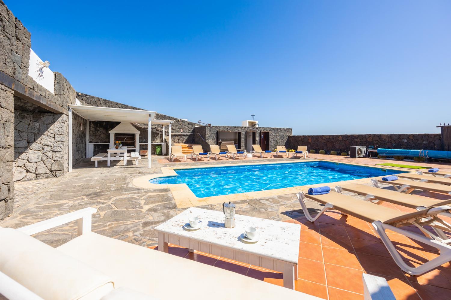 Private pool, terraces, and garden with panoramic sea views