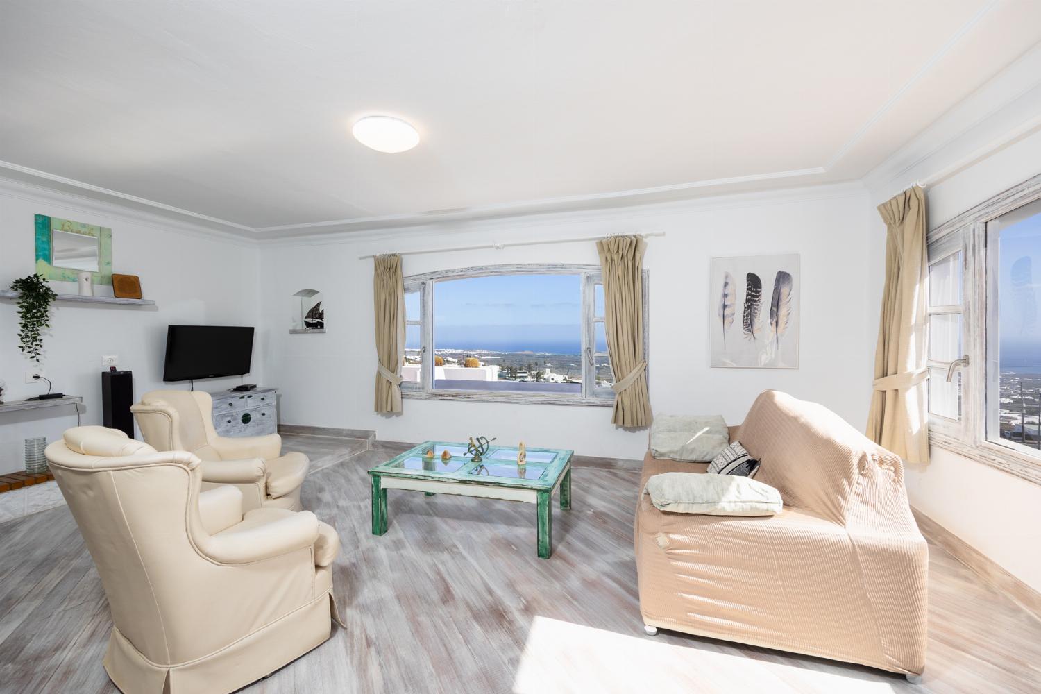 Unit 3: living room with sofa, ornamental fireplace, WiFi internet, satellite TV, and sea views