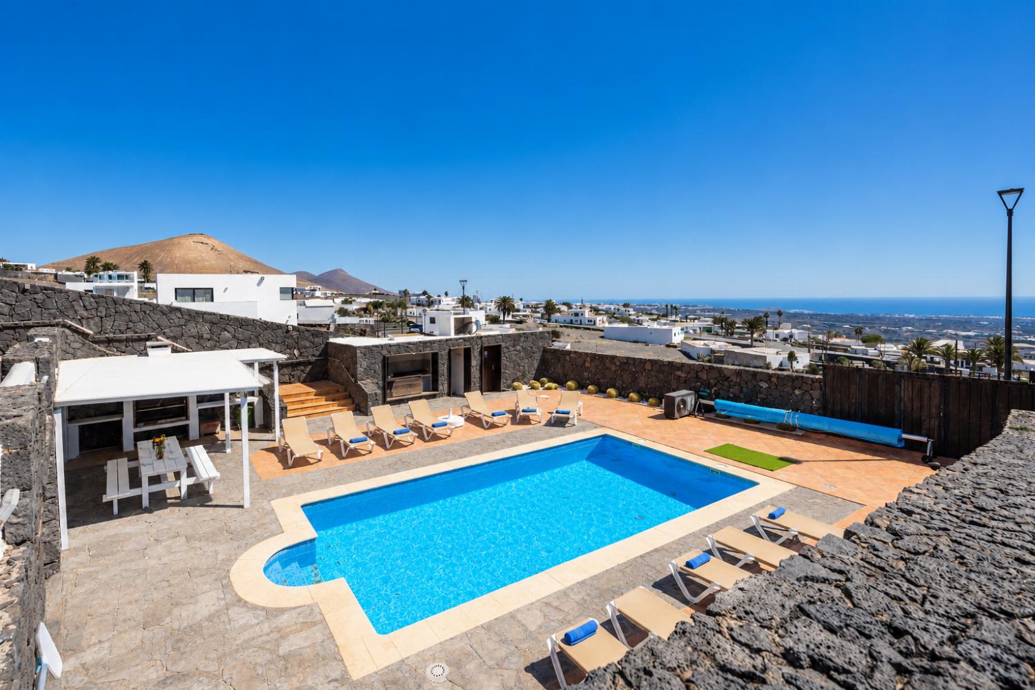 Private pool, terraces, and garden with panoramic sea views