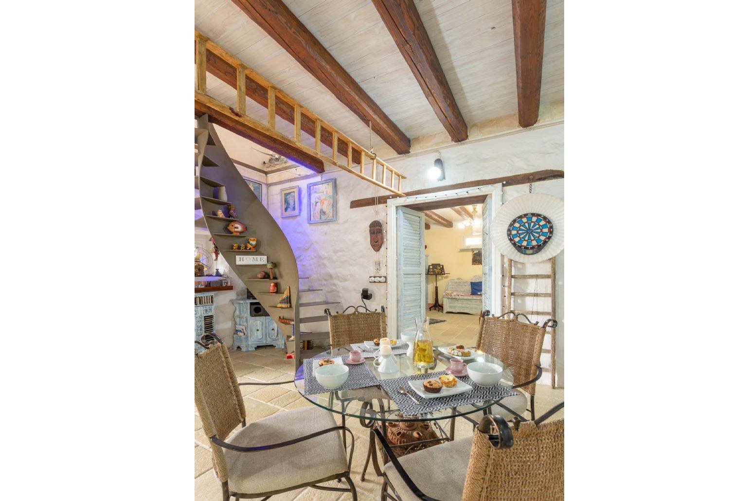 Living room with sofas, dining area, ornamental fireplace, WiFi internet, satellite TV, and terrace access