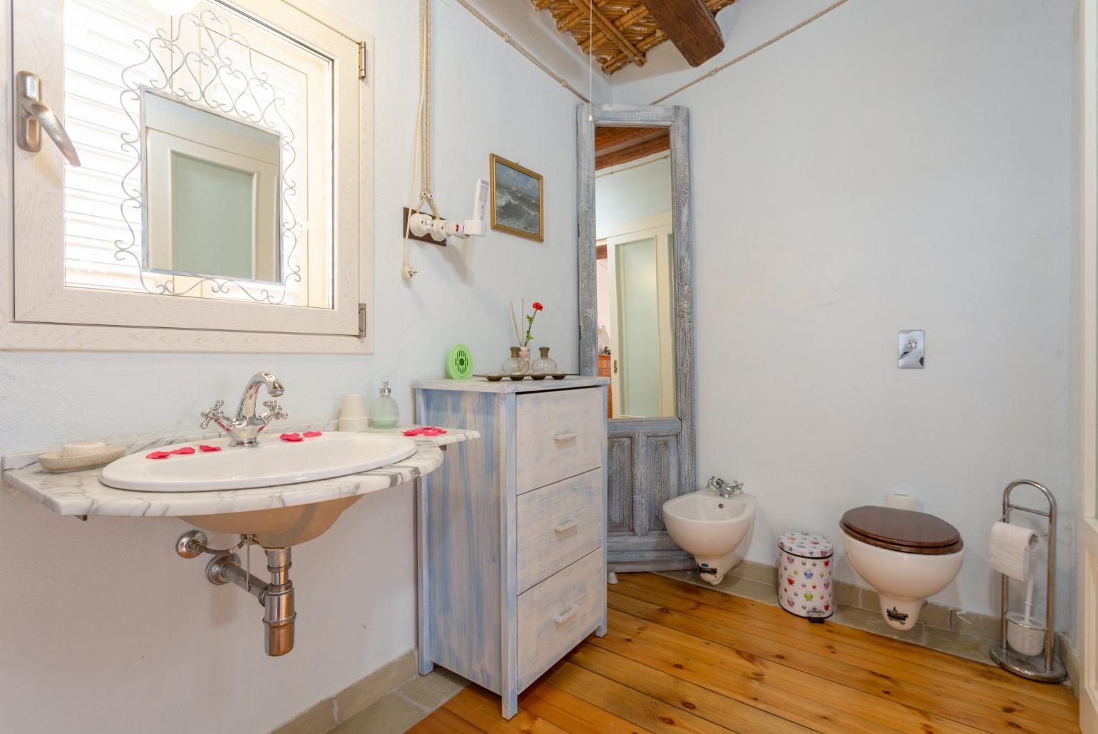 En suite bathroom with spa bath and shower