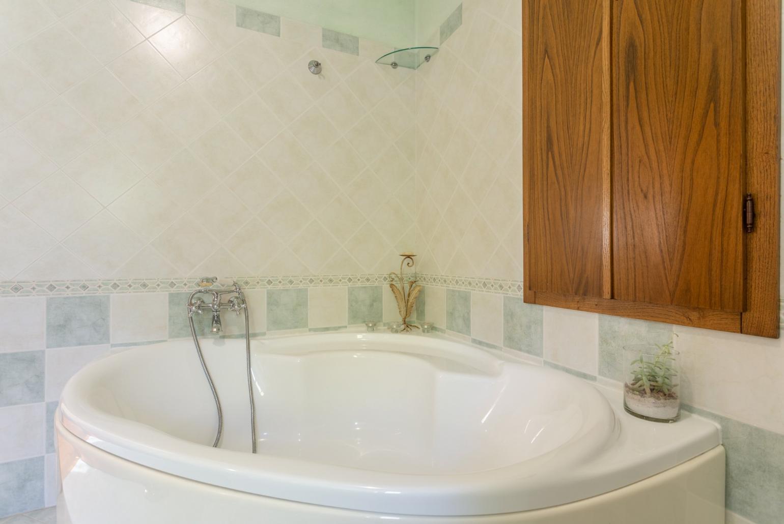 Family bathroom with bath and shower