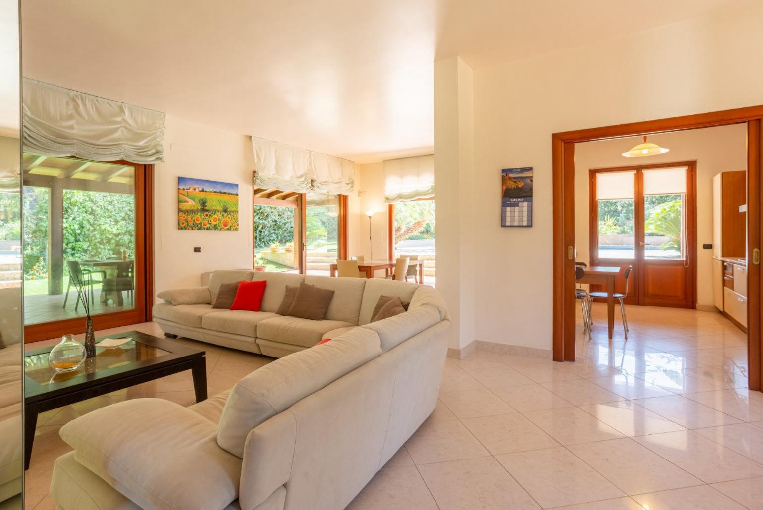 Living room with sofas, dining area, WiFi internet, and satellite TV