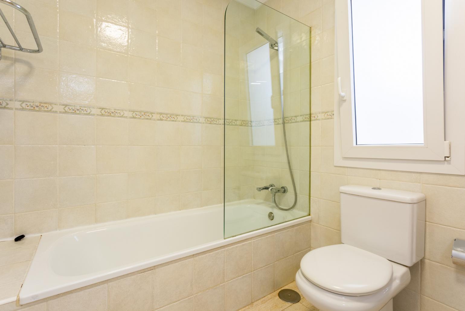 Family bathroom with bath and shower