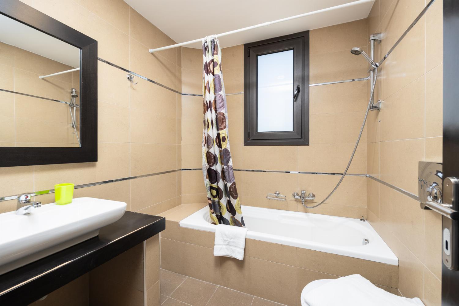 Family bathroom with bath and shower
