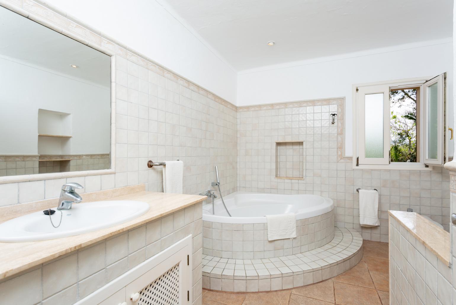 Family bathroom with bath and shower