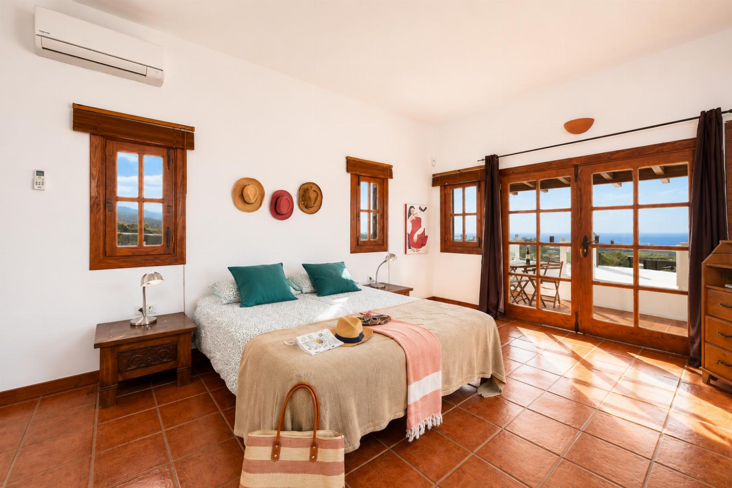 Double bedroom with en suite bathroom, A/C, and sea views