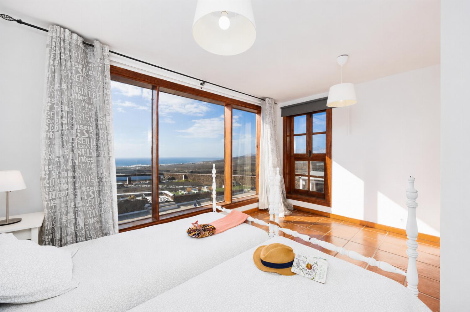 Twin bedroom with sea views