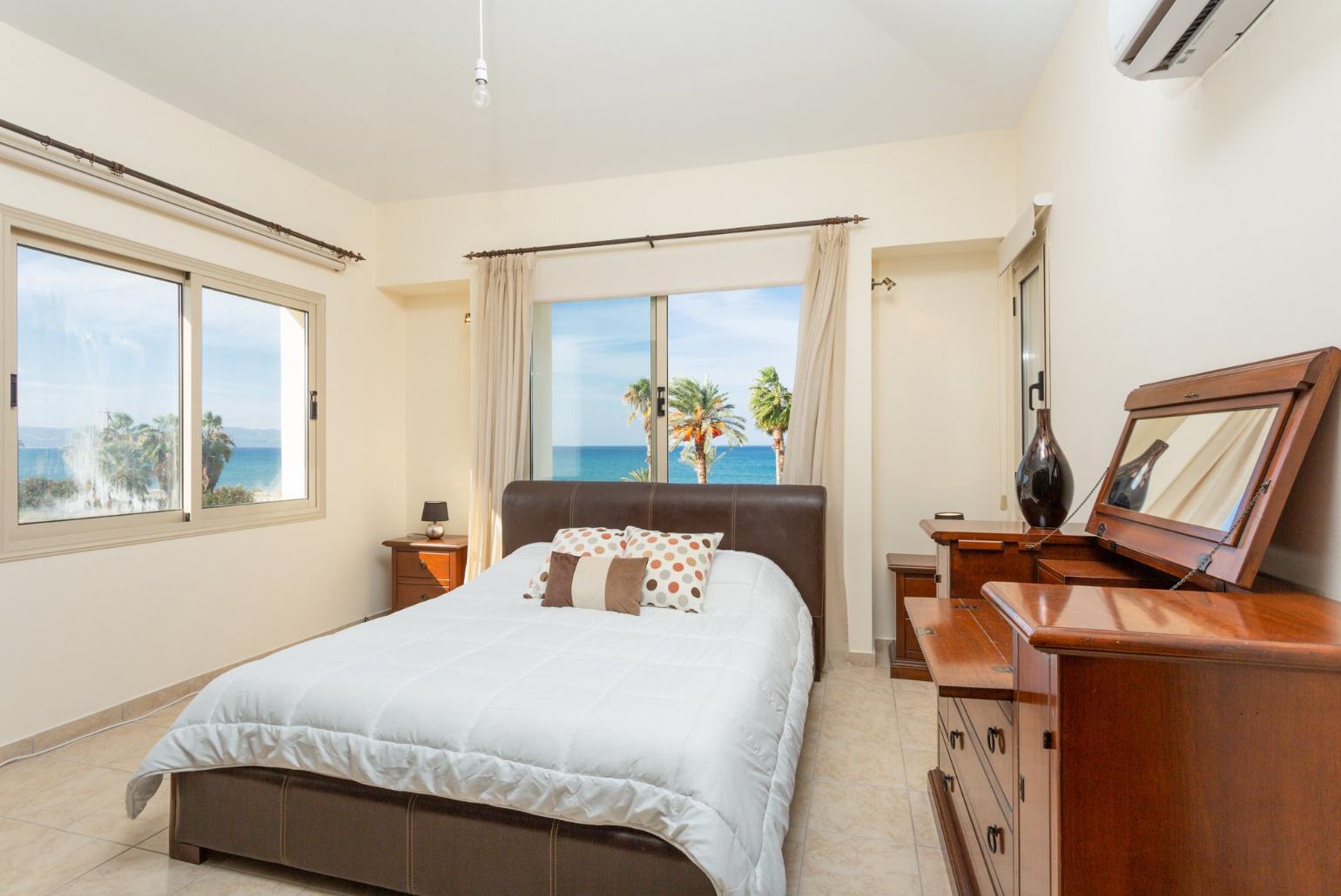 Double bedroom with en suite bathroom, A/C, and sea views