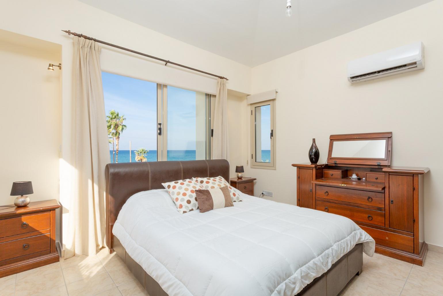 Double bedroom with en suite bathroom, A/C, and sea views