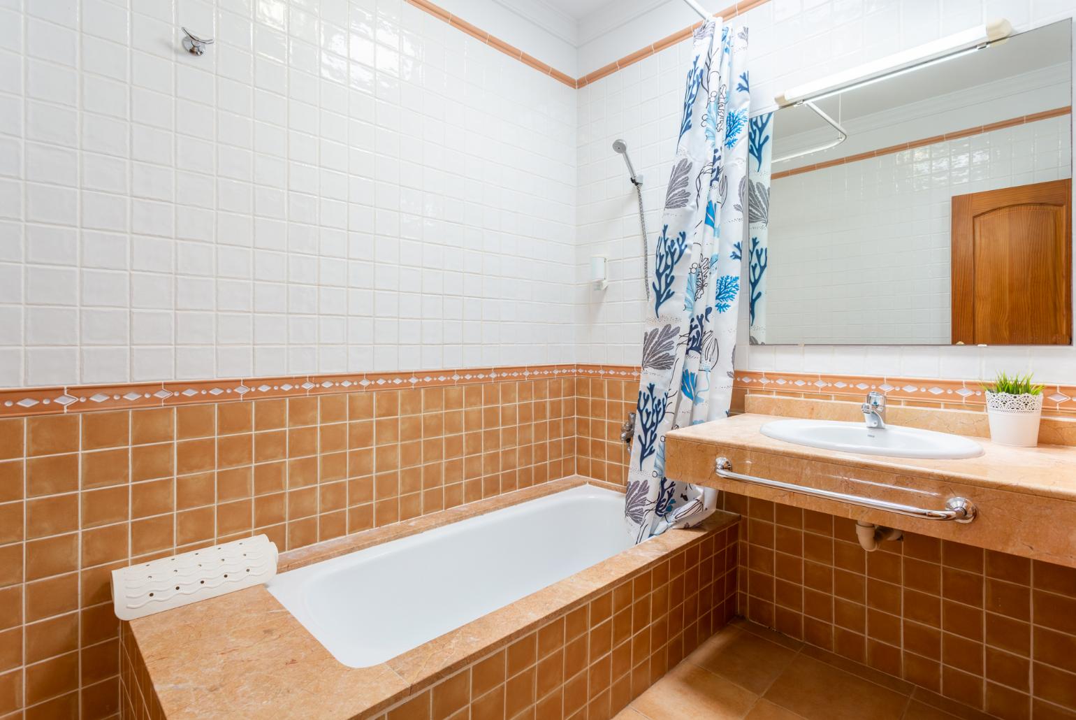 Family bathroom with bath and shower