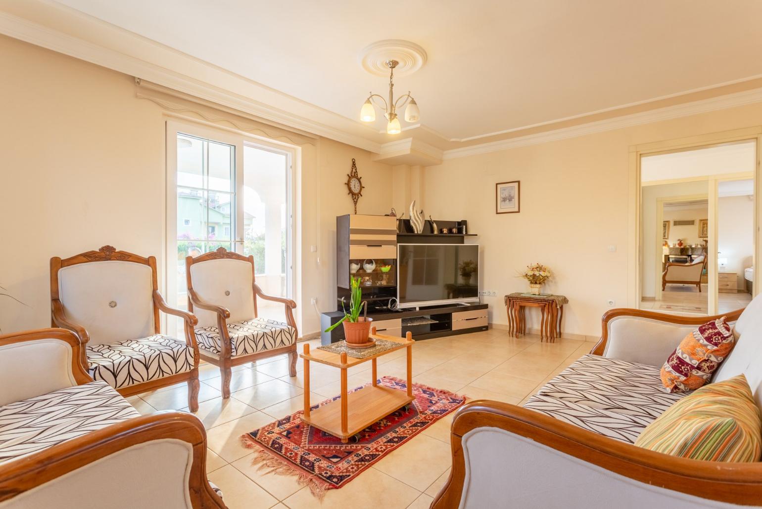 Living room with sofas, ornamental fireplace, A/C, WiFi internet, satellite TV, DVD player, and terrace access 