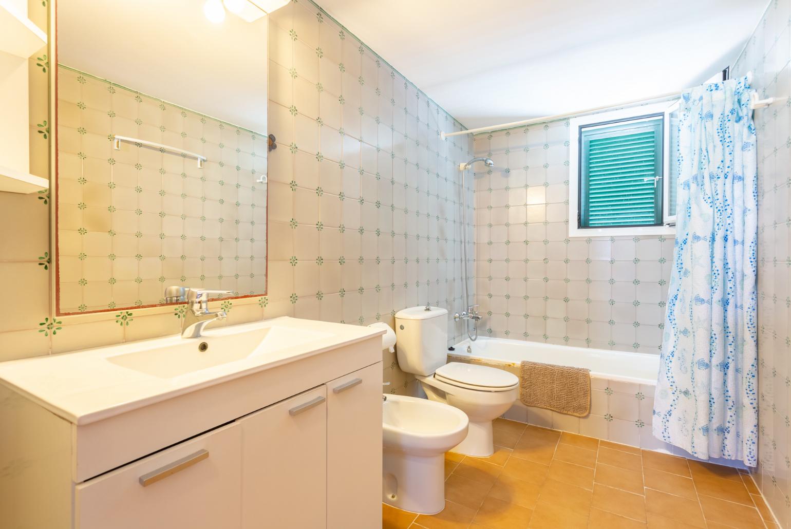 Family bathroom with bath and shower