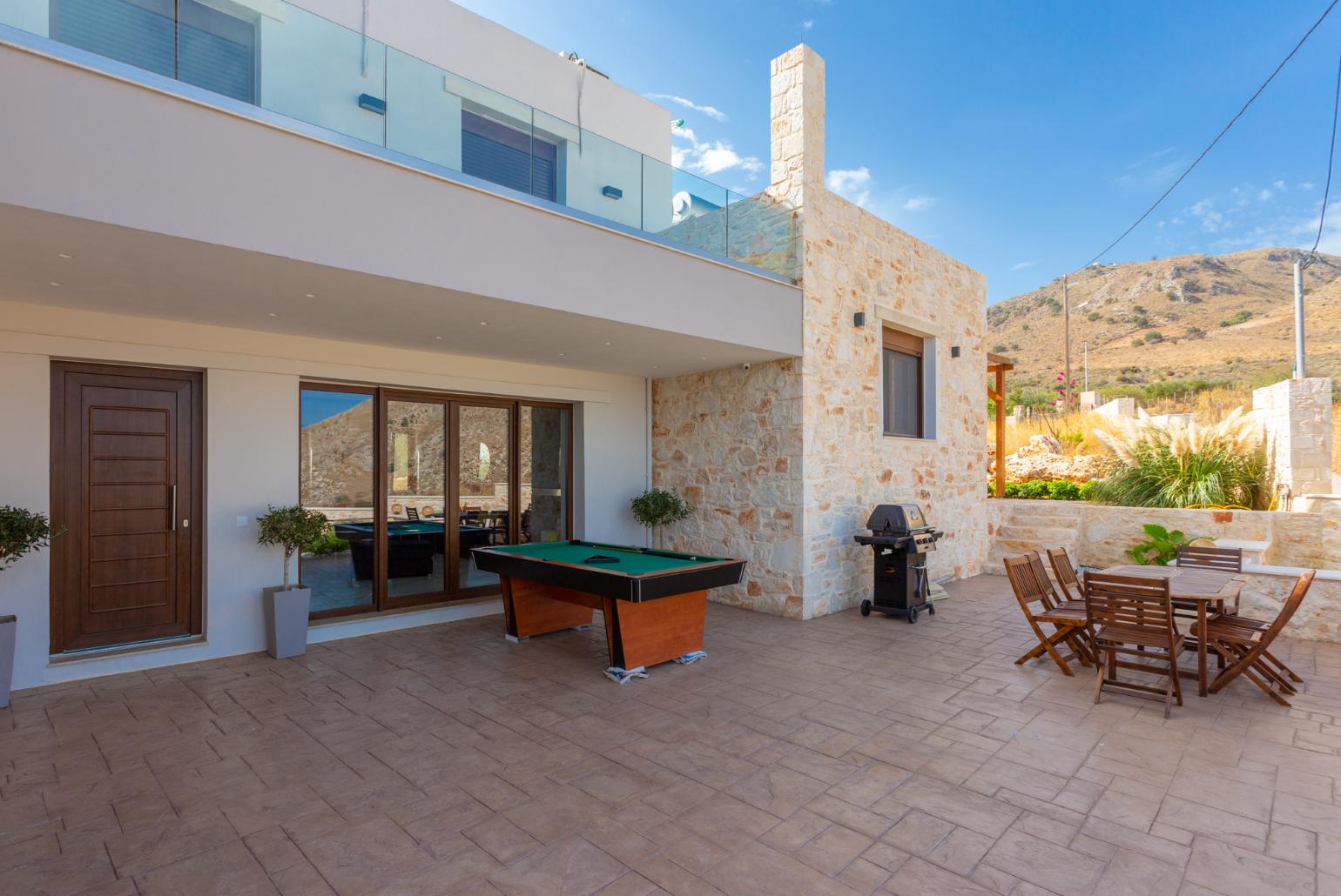 Terrace area with pool table and BBQ