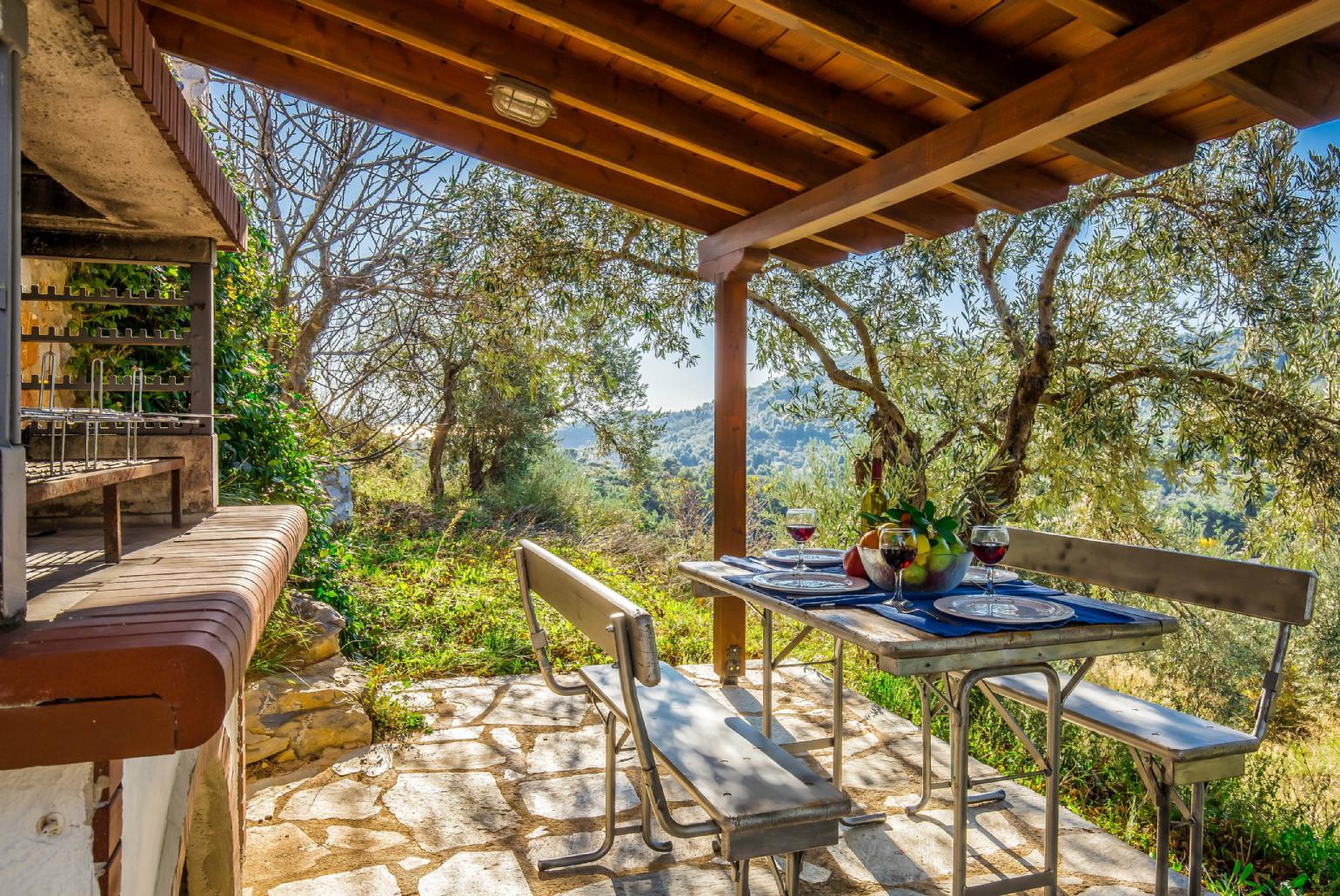 Outdoor dining area with BBQ