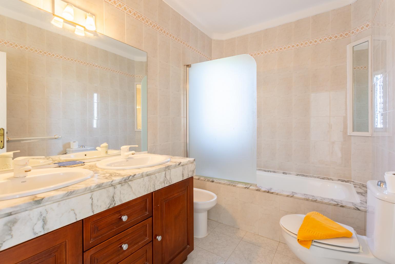 Family bathroom with bath and shower