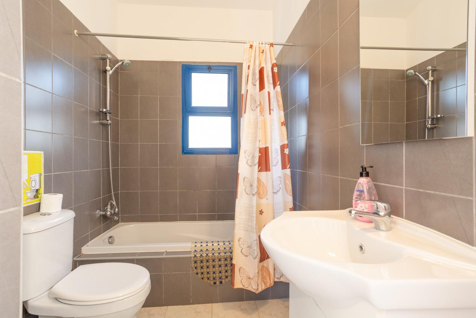 Family bathroom with bath and shower