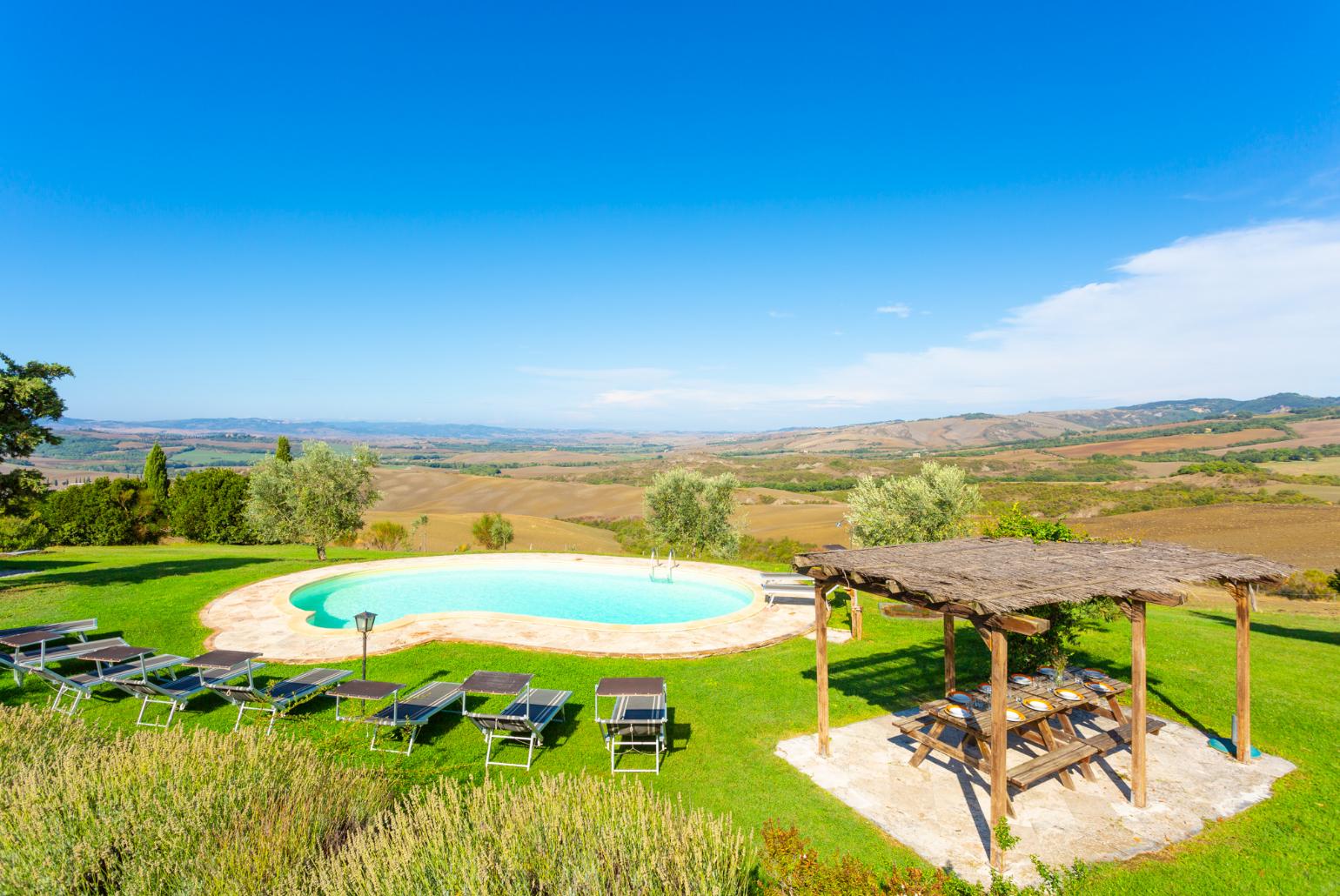 Private pool, terrace, and large lawn with panoramic Tuscan views