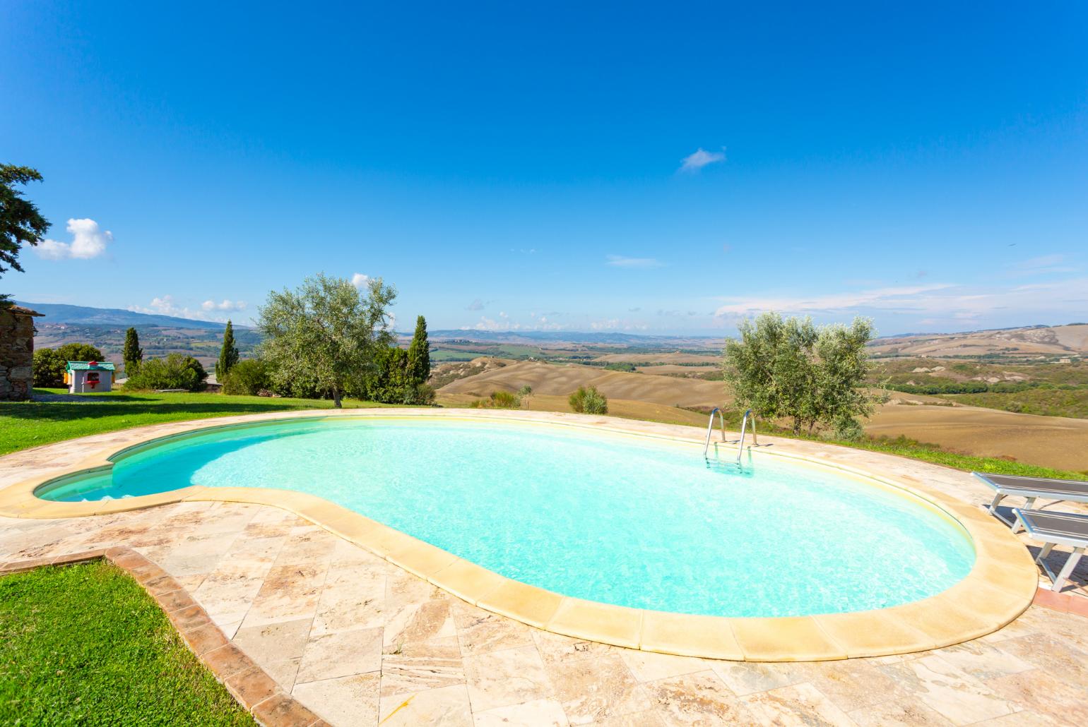 Private pool, terrace, and large lawn with panoramic Tuscan views