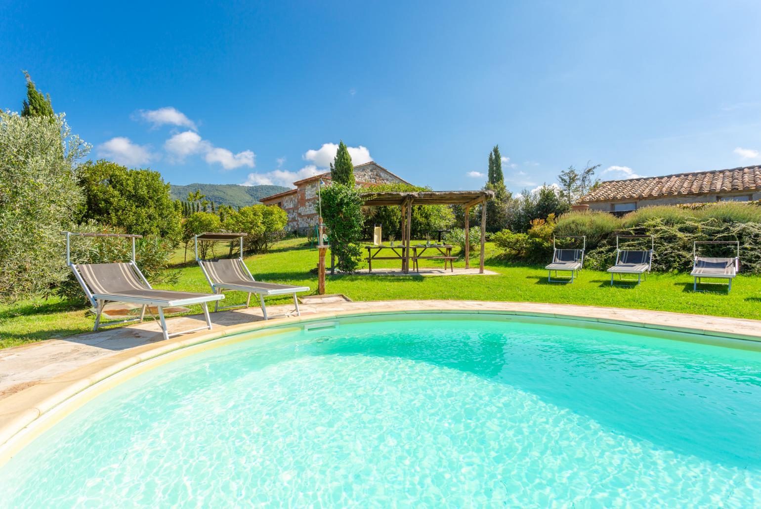 Private pool, terrace, and large lawn with panoramic Tuscan views