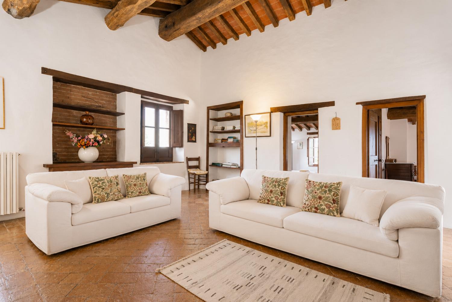 Living room with sofas, ornamental fireplace, WiFi internet, and satellite TV