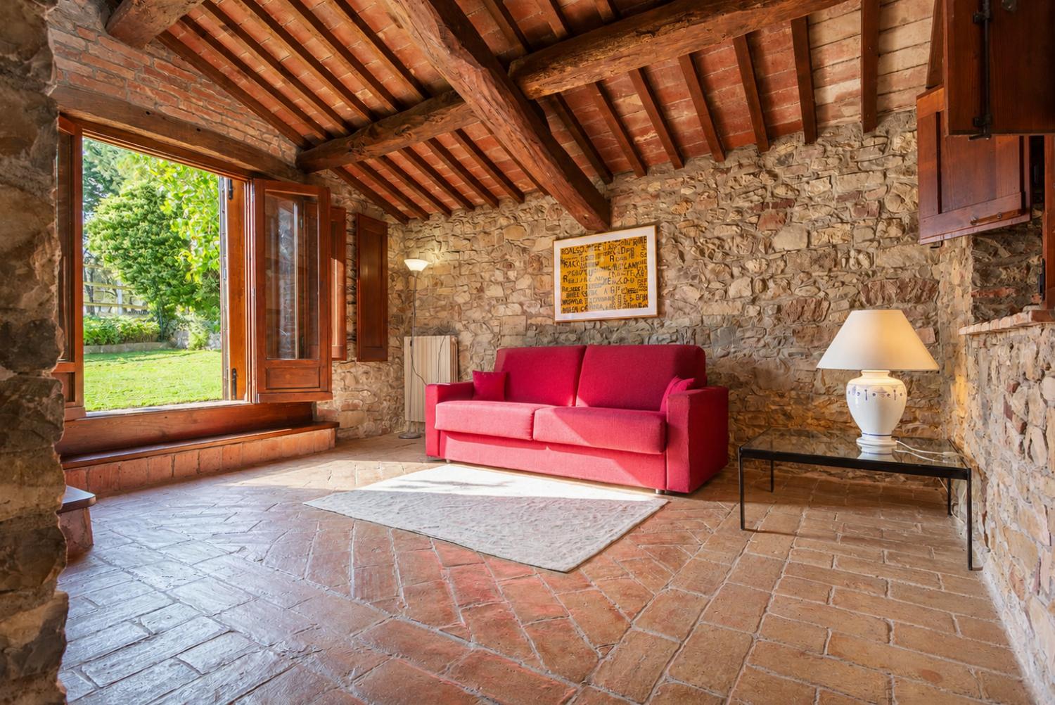 Living area with sofa and garden access