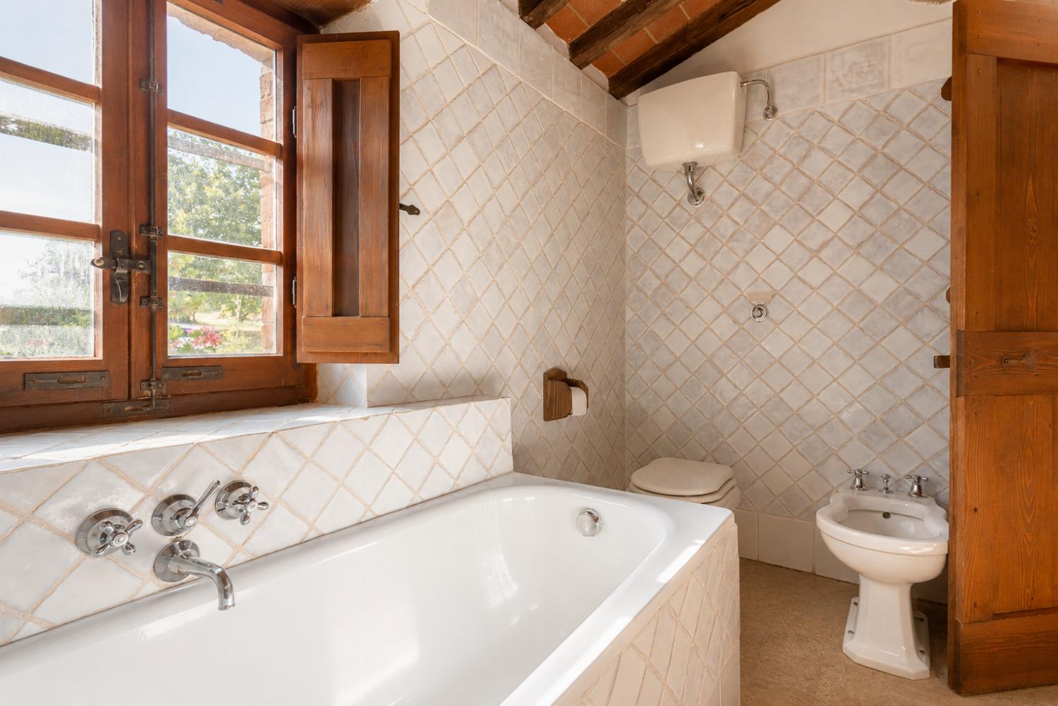 Family bathroom with bath and shower