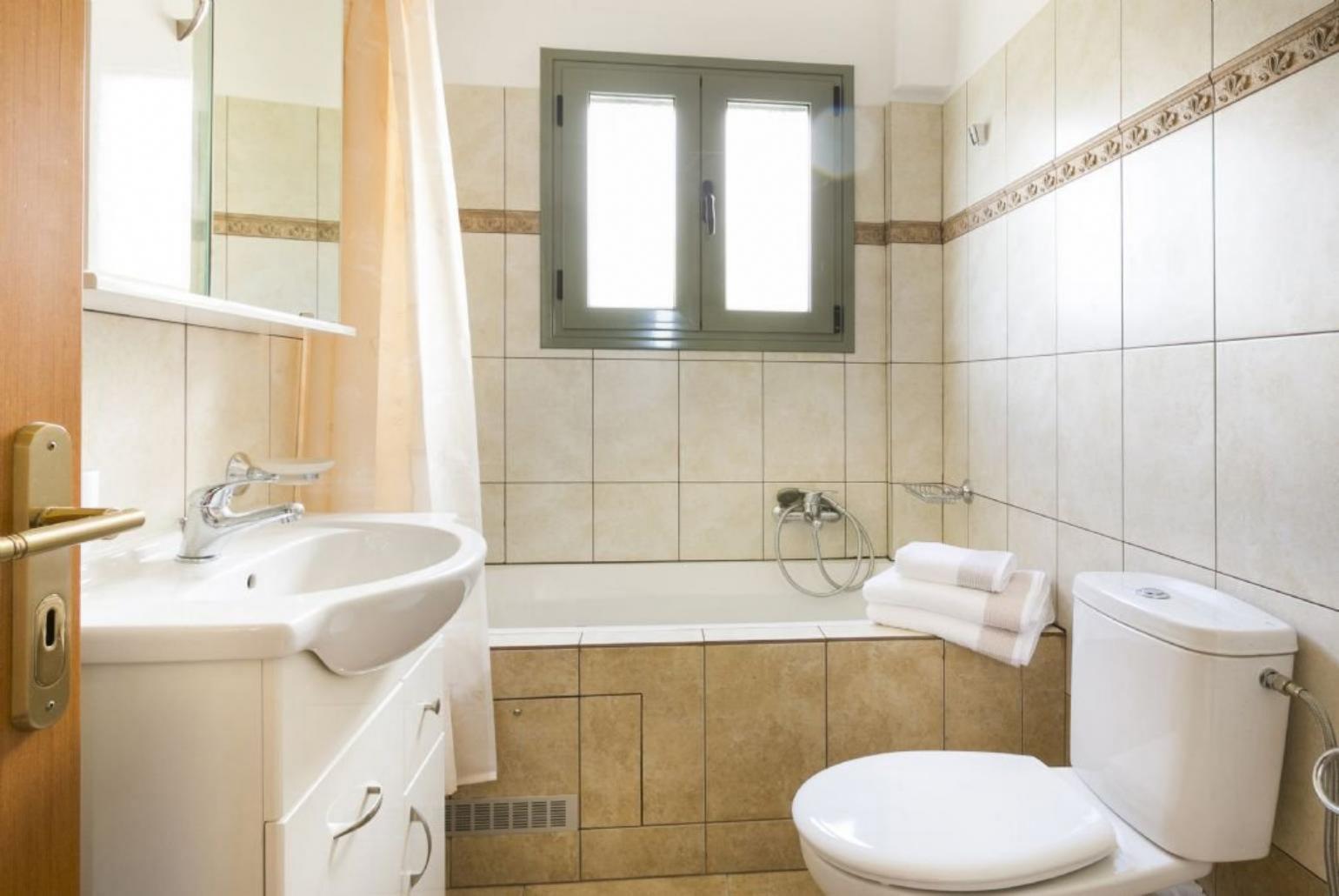 Bathroom with bath and shower