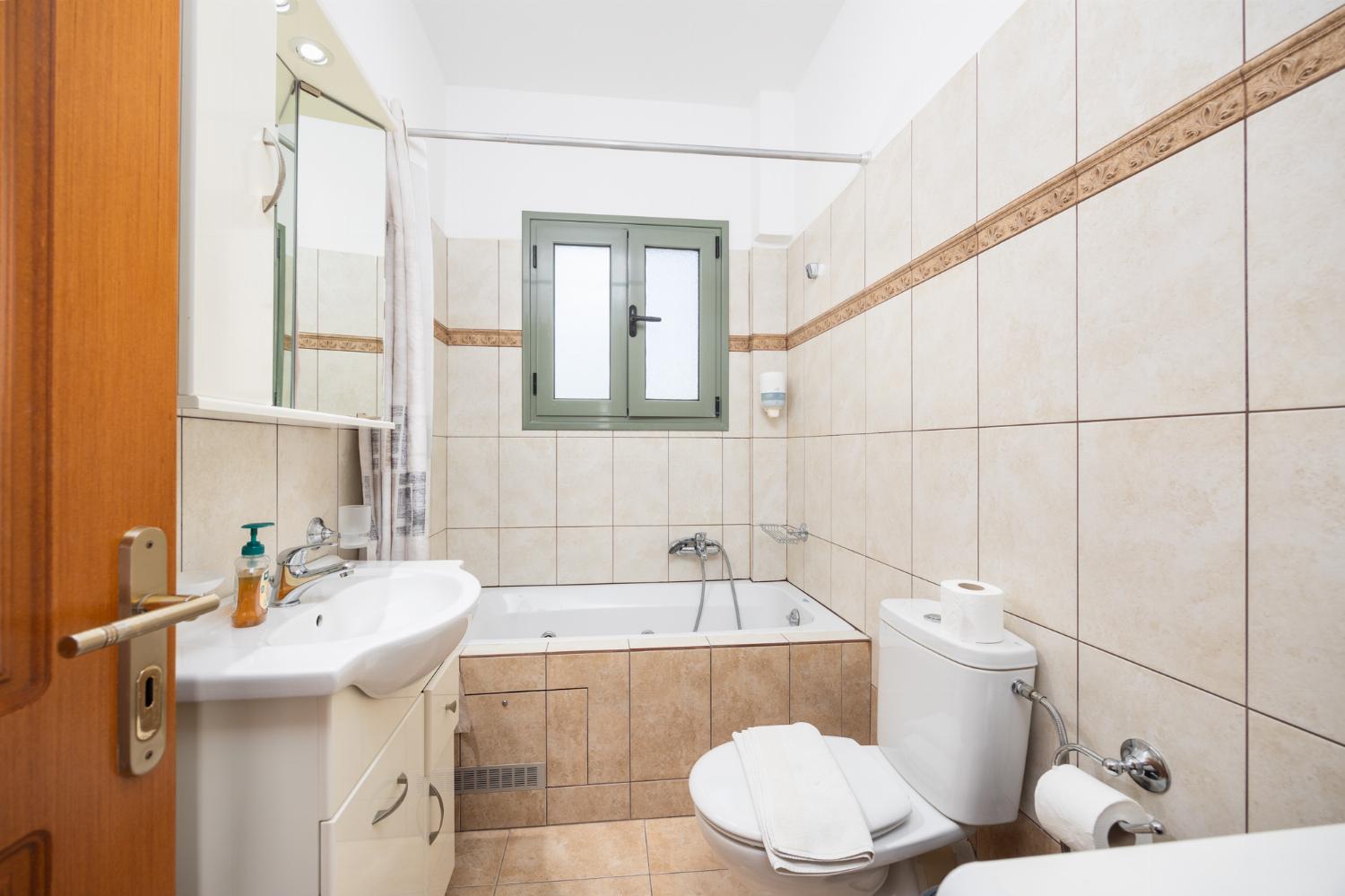 Family bathroom with bath and shower
