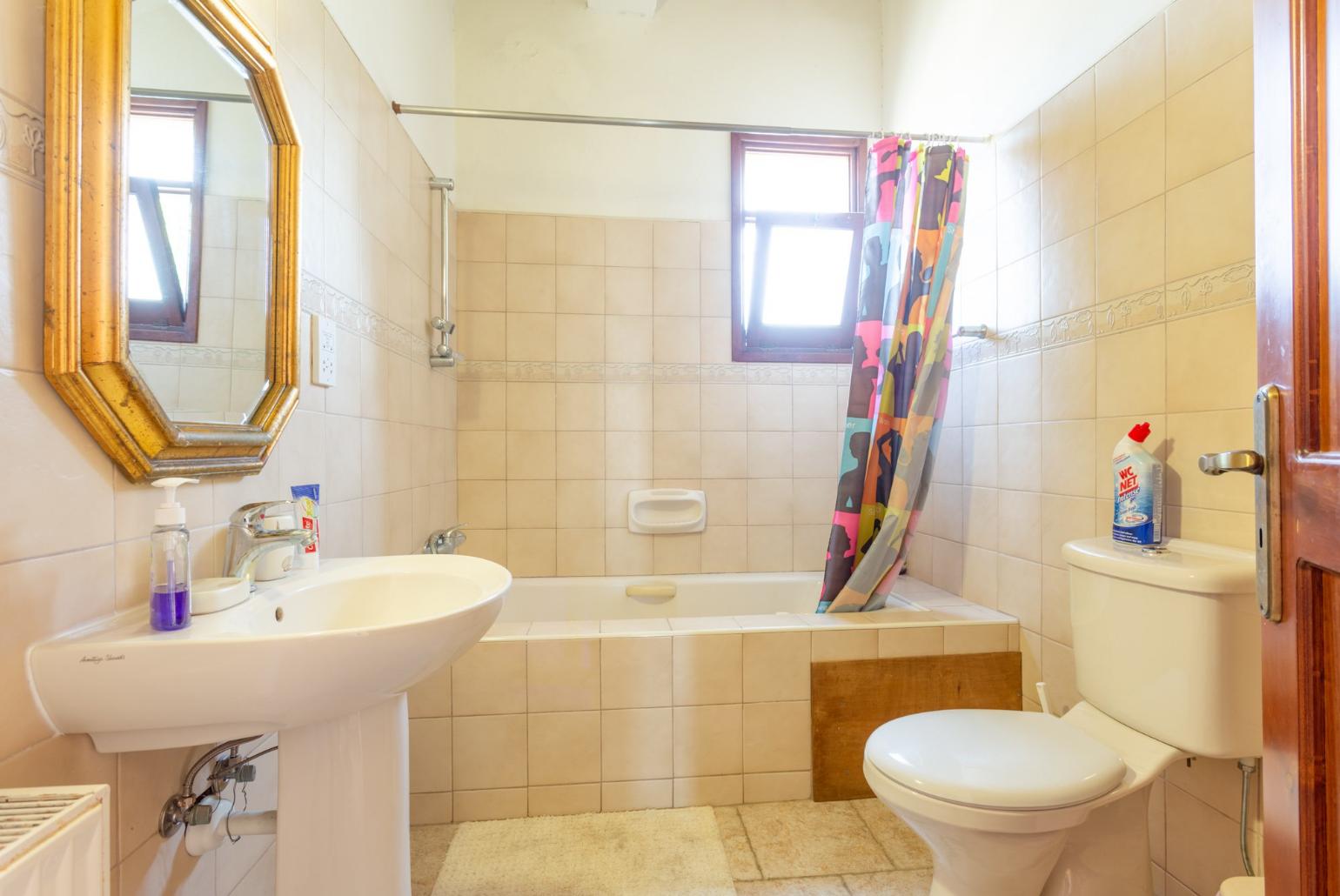 Family bathroom with bath and shower