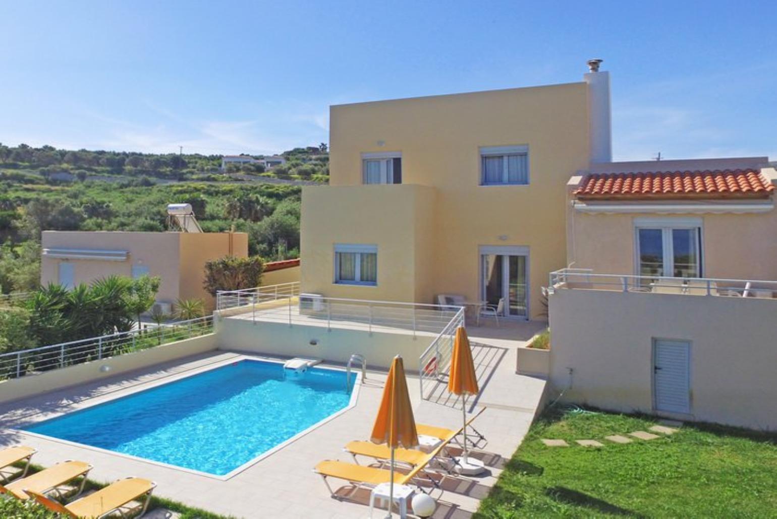 ,Beautiful villa with private pool, terrace, and lawn 