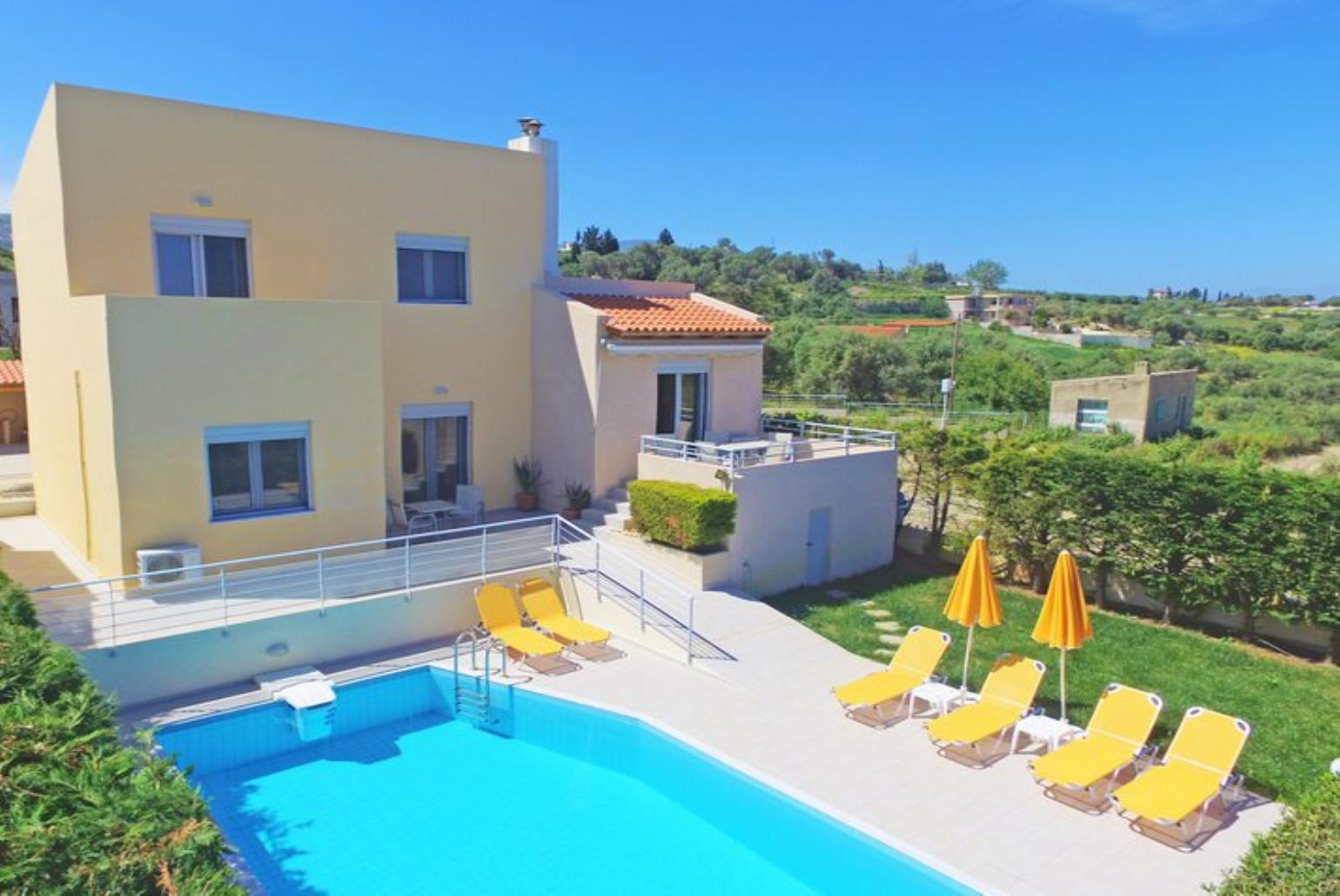 ,Beautiful villa with private pool, terrace, and lawn