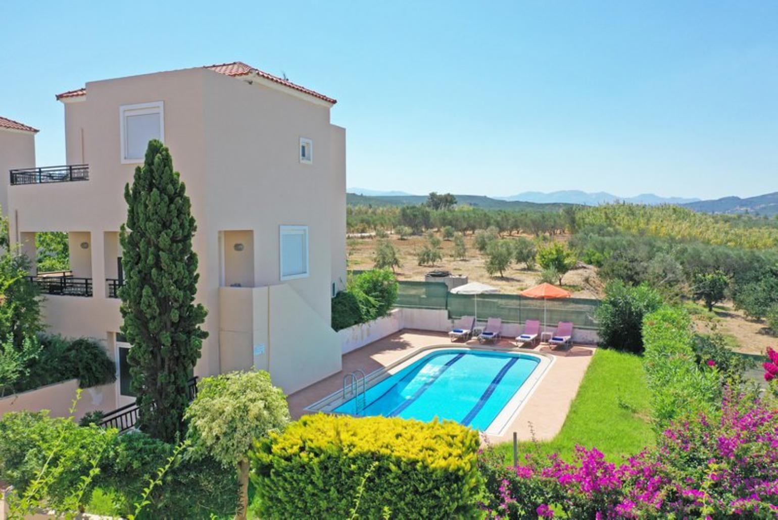 ,Beautiful villa with private pool, terrace, and lawn