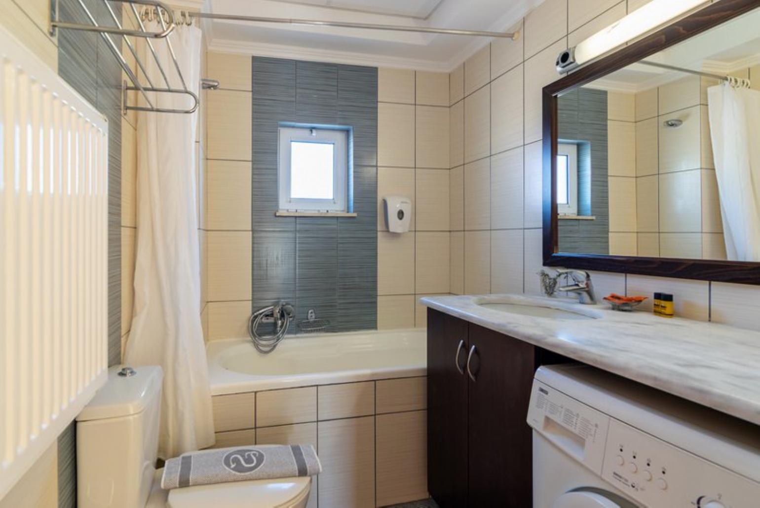 Bathroom  with washing machine 