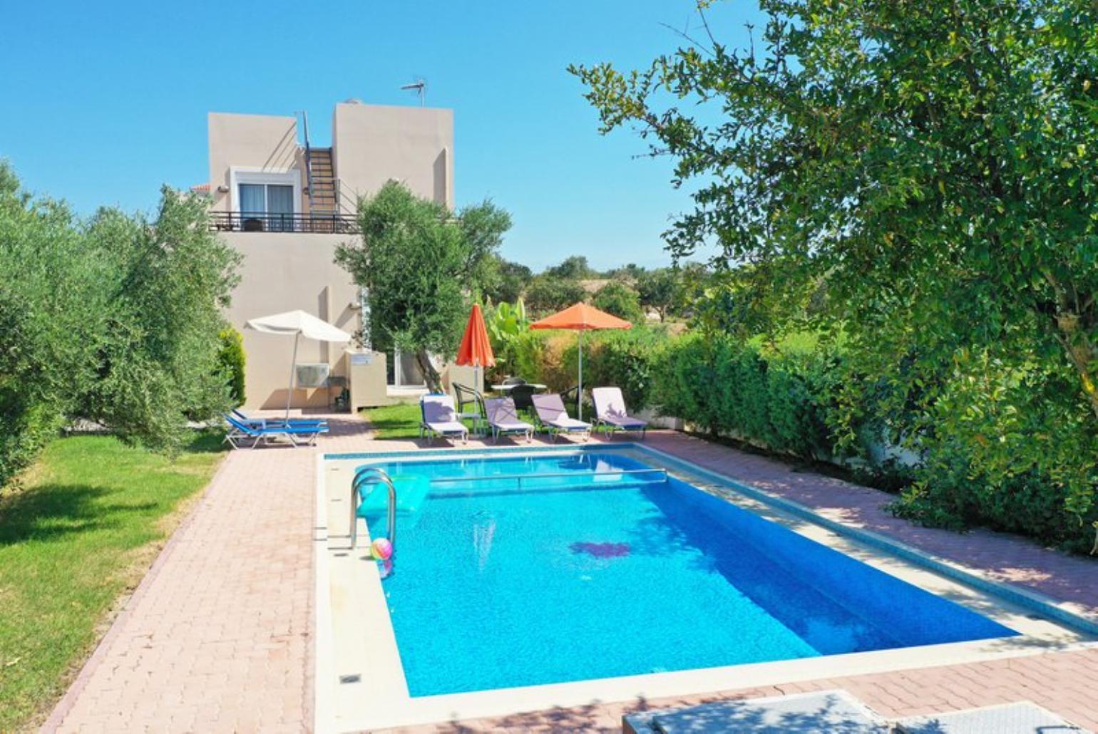 ,Beautiful villa with private pool, terrace, and lawn