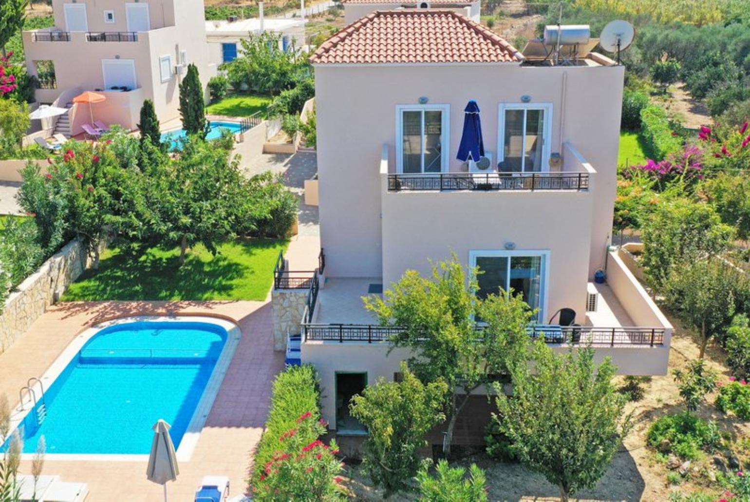 ,Beautiful villa with private pool, terrace, and lawn