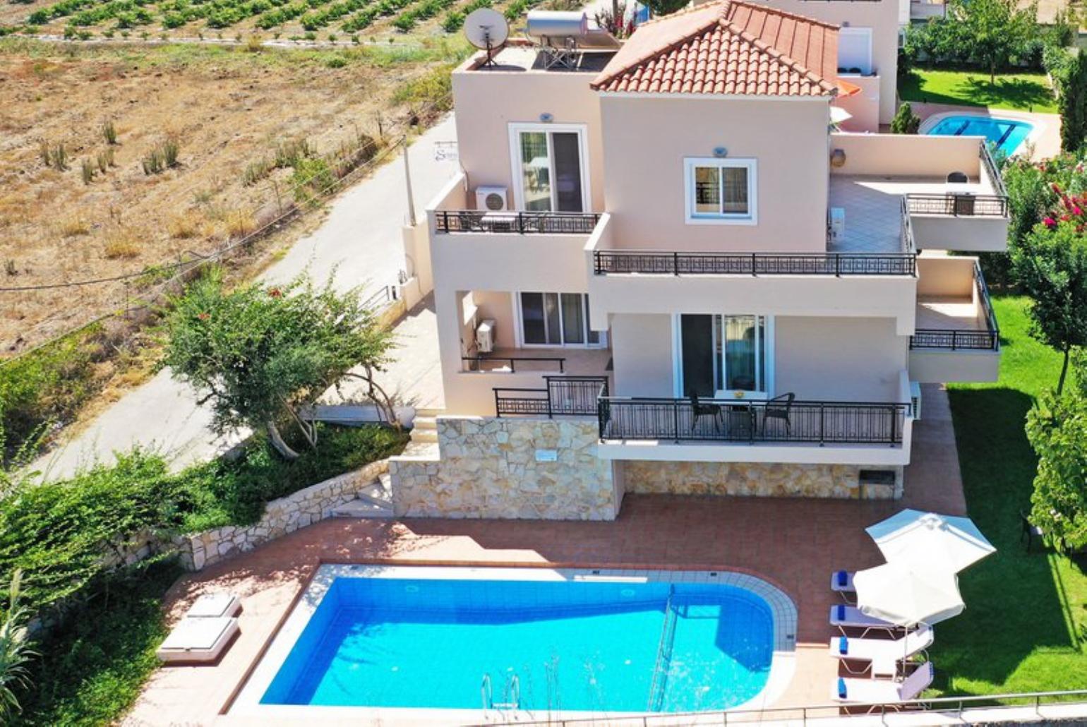 ,Beautiful villa with private pool, terrace, and lawn