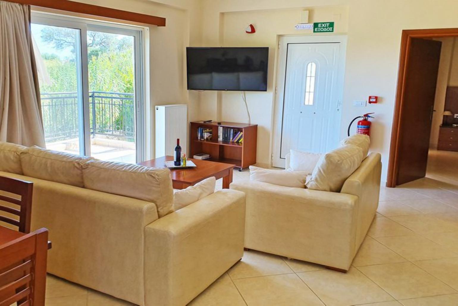 Open-plan living room with sofa, dining area